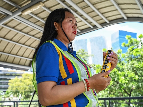 Traffic surveyor Irna Lapriza manually counting passing vehicles from a footbridge in Pasig City, Metro Manila. Image: Jam Sta Rosa / AFP© Traffic surveyor Irna Lapriza manually counting passing vehicles from a footbridge in Pasig City, Metro Manila. Image: Jam Sta Rosa / AFP©