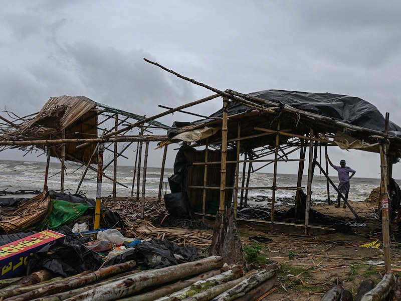 A villager stands near a damaged temporary house following the landfall of cyclone Dana in East Midnapore district around 180km southwest of Kolkata, on October 25, 2024. Cyclone Dana uprooted trees and power lines after making landfall on India"s east coast, with officials warning of more fierce weather on October 25.