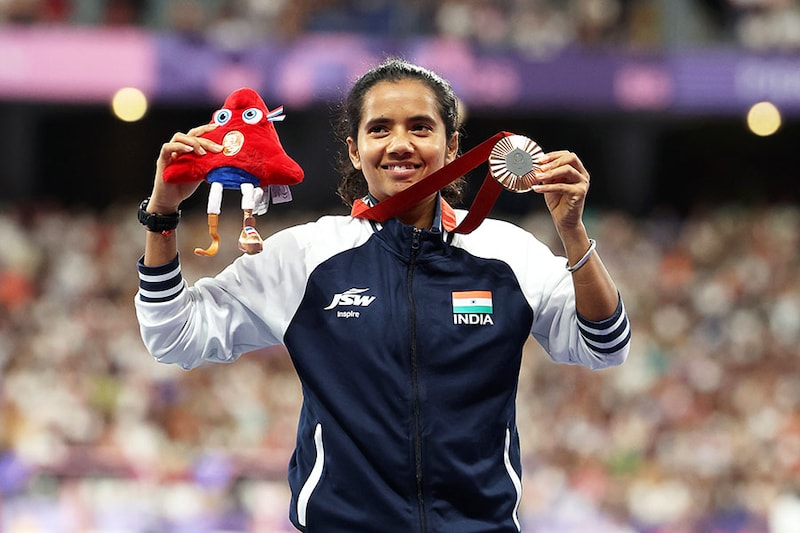Bronze medalist Preethi Pal of Team India celebrates on the podium at the Para Athletics Women"s 200m - T35 Medal Ceremony on day Four of the Paris 2024 Summer Paralympic Games at Stade de France on September 01, 2024 in Paris, France.