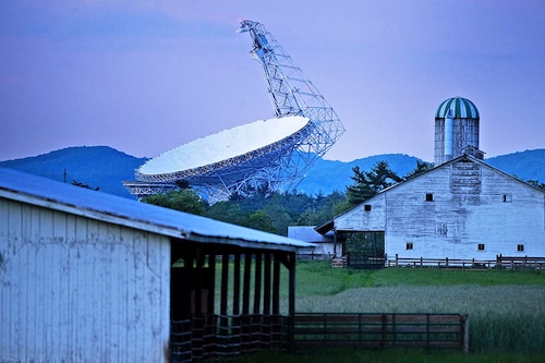 The Green Bank Telescope, a 100-meter fully steerable radio telescope, is seen near a farm in the Green Bank Observatory in the US National Radio Quiet Zone.
 Image: Brendan Smialowski / AFPÂ©