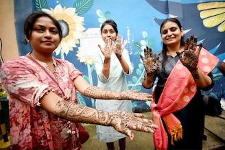 Women show off their stylish mehndi patterns on their hands on the eve of the Hartalika Teej festival on September 5, 2024, at the Maurya Lok Complex, Patna, India. Teej is a yearly celebration that marks the advent of monsoons.