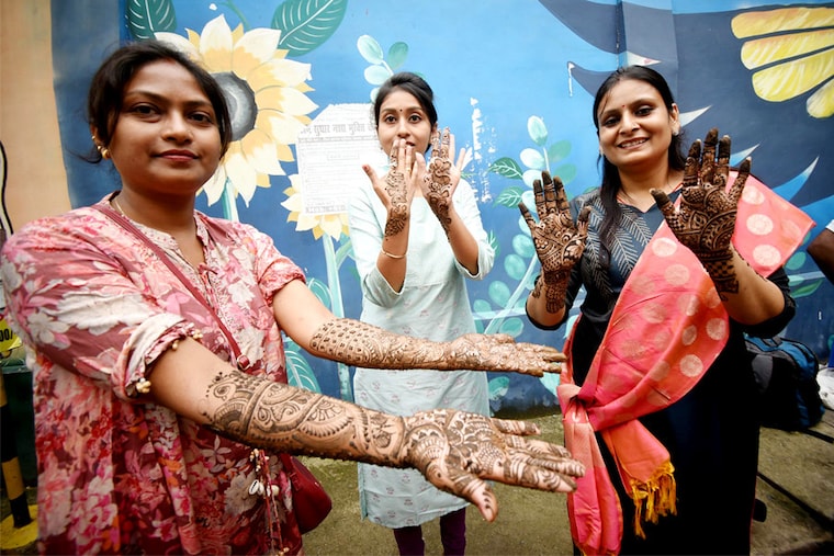 Women show off their stylish mehndi patterns on their hands on the eve of the Hartalika Teej festival on September 5, 2024, at the Maurya Lok Complex, Patna, India. Teej is a yearly celebration that marks the advent of monsoons.