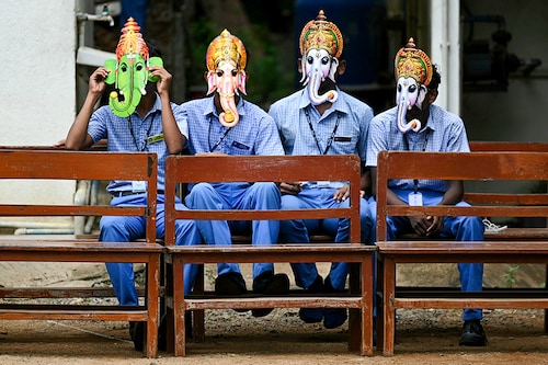 Children wear masks in the guise of Hindu deity Ganesha, at a school in Chennai on September 6, 2024, on the eve of Ganesh Chaturthi festival.
