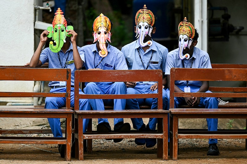 Children wear masks in the guise of Hindu deity Ganesha, at a school in Chennai on September 6, 2024, on the eve of Ganesh Chaturthi festival.