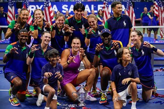 Tournament champion Belarus"s Aryna Sabalenka poses with the ball crew after the women"s final match on day thirteen of the US Open tennis tournament at the USTA Billie Jean King National Tennis Center in New York City, on September 7, 2024.