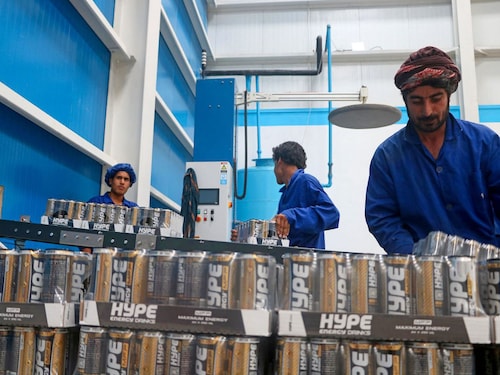In this photo taken on August 12, 2024, Afghan workers process energy drinks at a factory in Herat.
Image: Mohsen Karimi / AFP© In this photo taken on August 12, 2024, Afghan workers process energy drinks at a factory in Herat.
Image: Mohsen Karimi / AFP©