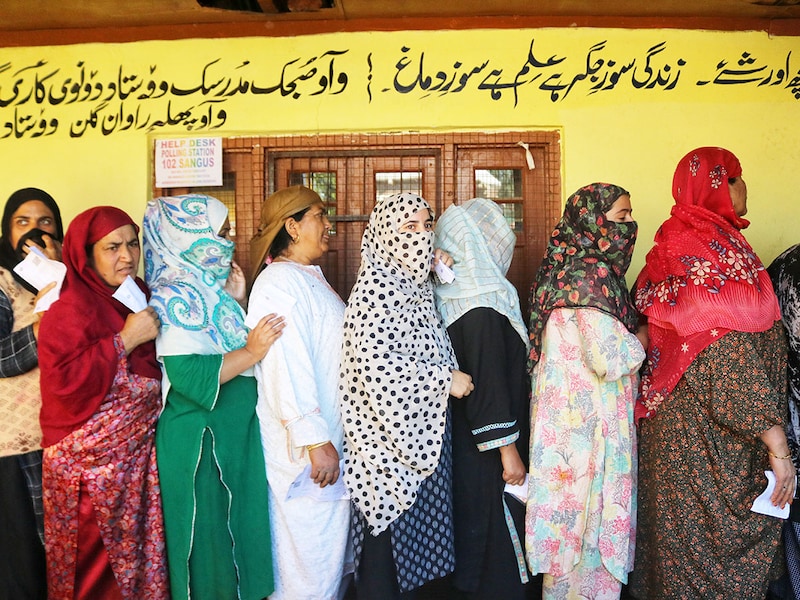 Women voters queue to cast their ballots at a polling station during the first phase of assembly elections in Kulgam, south of Srinagar, Jammu and Kashmir, on September 18, 2024. The Election Commission of India is conducting the assembly elections in Kashmir after 10 years, as the territory"s special status was revoked in 2019.