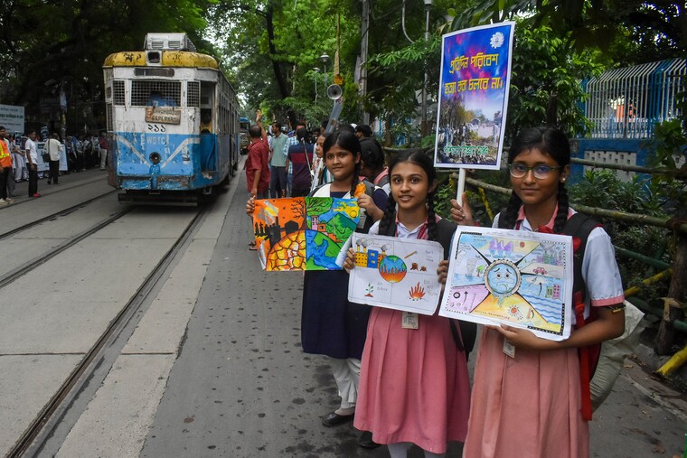 Students display their paintings dedicated to the protection of the global climate during a protest demonstration on Global Climate Strike 2024 in Kolkata, India, on September 27, 2024.