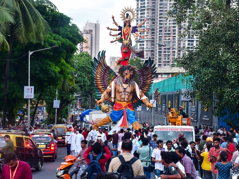 Devotees carry Goddess Durga idol to the pandal ahead of the Navratri festival on September 29, 2024, in Mumbai, India.