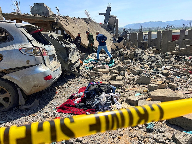 People inspect the site of a US airstrike in Sanaa, Yemen, on April 7, 2025. According to the Houthi-run Al-Masirah TV, the strike took place in the Shaab Al-Hafa neighbourhood in the Shu"ub district in the capital and killed 4 Yemenis and injured dozens. The US has been conducting its biggest military attacks against the Yemeni group under President Donald Trump"s administration since March 15.