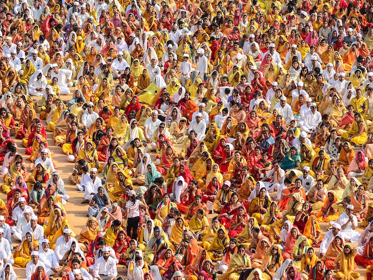 Devotees from the Jain community participate in a mass recitation of a mantra on "Vishwa Navkar Mahamantra Day" at a stadium in Jabalpur on April 9, 2025.