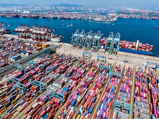 Container ships are seen at the port in Qingdao, in China"s eastern Shandong province on April 15, 2025. China on April 16 said its economy grew a forecast-beating 5.4 percent in the first quarter as exporters rushed to get goods out of factory gates ahead of swingeing new US tariffs. 
Image: AFP  / China Out
