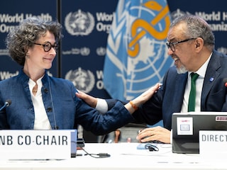 A handout photo shows Co-chair of the negotiations and French ambassador for Global Health Anne-Claire Amprou (left) and WHO Director-General Tedros Adhanom Ghebreyesus after a consensus on the Pandemic Agreement at the WHO headquarters  in Geneva on April 16, 2025.
Image: Christopher Black / WHO / AFP
