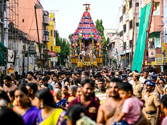 Hindu devotees take part in a religious procession to mark the chariot festival of Sri Parthasarthy Swamy temple in Chennai on April 19, 2025.