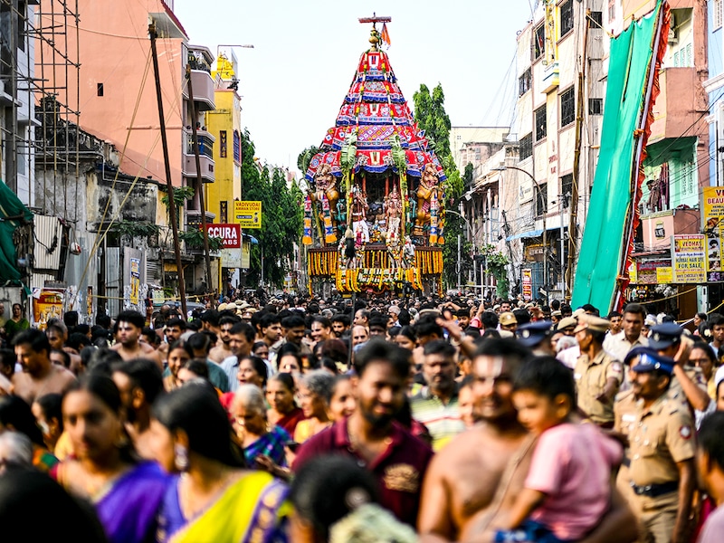 Hindu devotees take part in a religious procession to mark the chariot festival of Sri Parthasarthy Swamy temple in Chennai on April 19, 2025.