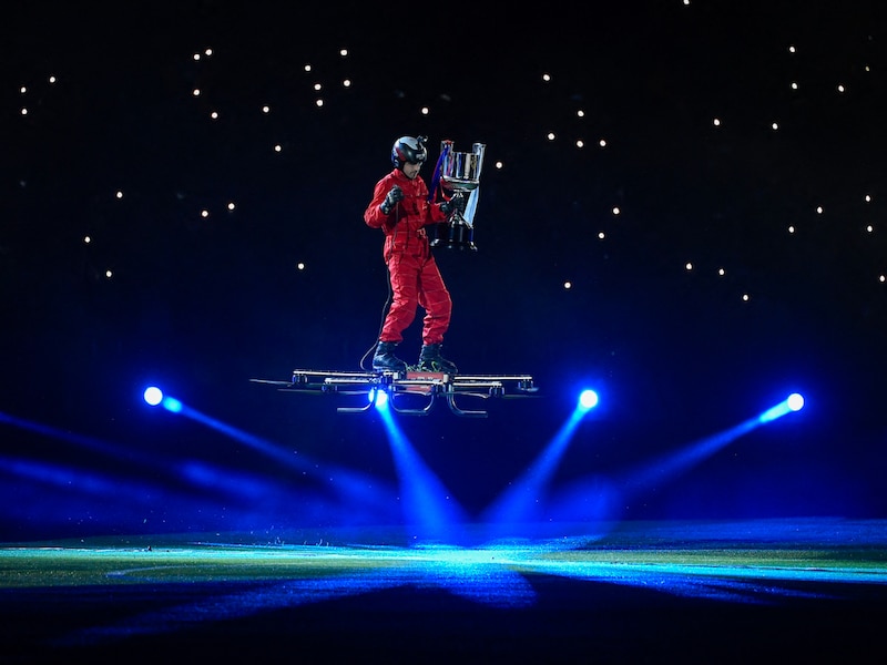 A person operates a SkySurfer aircraft as he carries the trophy to the stadium grounds for the the Copa del Rey (King"s Cup) final football match between FC Barcelona and Real Madrid CF at La Cartuja stadium in Seville on April 26, 2025. Barcelona won their 32nd Copa del Rey title after Jules Kounde"s goal in extra time secured the 3-2 victory over Real Madrid.