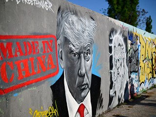 A mural by Berlin-based graffitti artist Eme Freethinker of US President Donald Trump and the lettering reading "Made in China" is pictured on a wall at the Mauerpark public park in Berlin, Germany on April 26, 2025.  
Image: Tobias Schwarz / AFP
