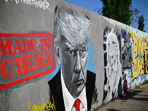 A mural by Berlin-based graffitti artist Eme Freethinker of US President Donald Trump and the lettering reading "Made in China" is pictured on a wall at the Mauerpark public park in Berlin, Germany on April 26, 2025.  
Image: Tobias Schwarz / AFP