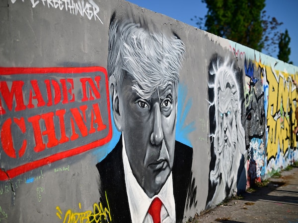 A mural by Berlin-based graffitti artist Eme Freethinker of US President Donald Trump and the lettering reading "Made in China" is pictured on a wall at the Mauerpark public park in Berlin, Germany on April 26, 2025.
Image: Tobias Schwarz / AFP