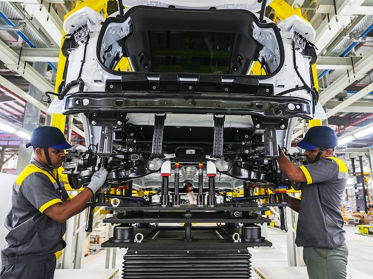 Workers assemble a car at the VinFast electric vehicle plant in Thoothukudi, Tamil Nadu on August 4, 2025. Inaugurating the first plant outside its home country Vietnam today, VinFast"s 408-acre facility is equipped to assemble two premium electric SUV models and roll out 50,000 vehicles per annum initially.