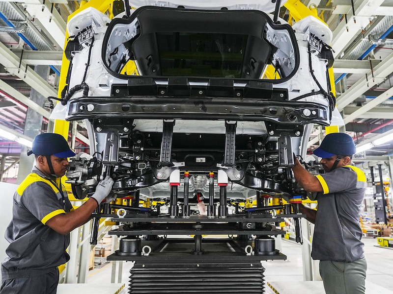 Workers assemble a car at the VinFast electric vehicle plant in Thoothukudi, Tamil Nadu on August 4, 2025. Inaugurating the first plant outside its home country Vietnam today, VinFast"s 408-acre facility is equipped to assemble two premium electric SUV models and roll out 50,000 vehicles per annum initially.