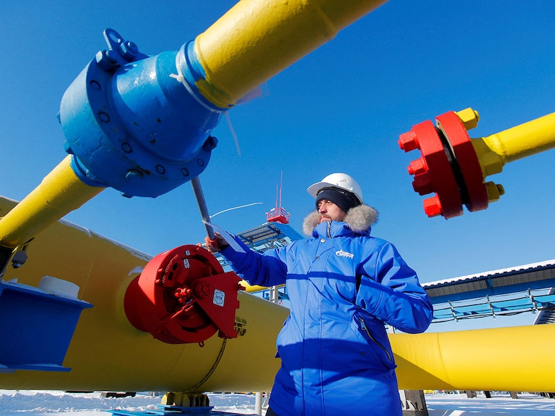 This file photo shows a worker checking a gas valve at the Atamanskaya compressor station, part of Gazprom"s Power Of Siberia gas pipeline outside Svobodny in the Amur region, Russia. US President Donald Trump, in a social media post on August 4, 2025, threatened India with much steeper tariffs over its imports of Russian oil.
