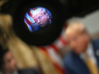 US President Donald Trump, seen through the viewfinder of a video camera, speaks during a cabinet meeting in the Cabinet Room of the White House in Washington, DC.
Image: Andrew Caballero-Reynolds / AFP