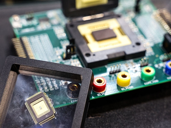 (FILES) A sample of a semiconductor chipâ€ made by Taiwan Semiconductor Manufacturing Company (TSMC).
Image:I-HWA Cheng / AFP