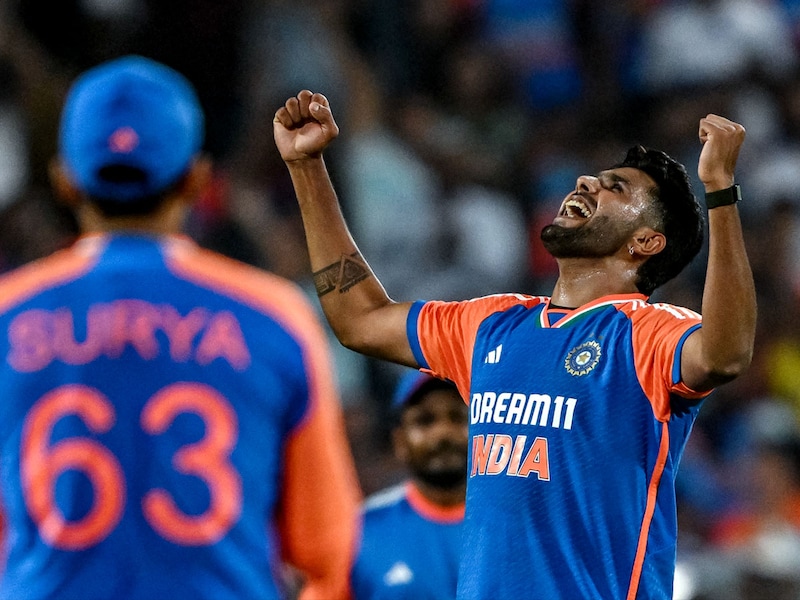 India"s Harshit Rana celebrates after taking the wicket of England"s Jamie Overton during the fourth T20 international cricket match between India and England at the Maharashtra Cricket Association Stadium in Pune on January 31, 2025.