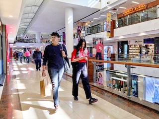 File Photo: Shoppers walk inside a shopping mall in New Delhi. Image: REUTERS/Anushree Fadnavis