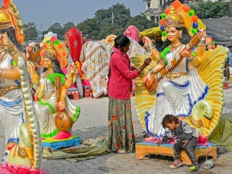 An artist paints an idol of the Hindu deity Saraswati ahead of the "Basant Panchami" festival on the outskirts of Amritsar. Basant Panchami is being celebrated on February 2, 2025.