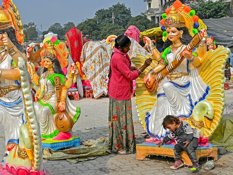 An artist paints an idol of the Hindu deity Saraswati ahead of the "Basant Panchami" festival on the outskirts of Amritsar. Basant Panchami is being celebrated on February 2, 2025.