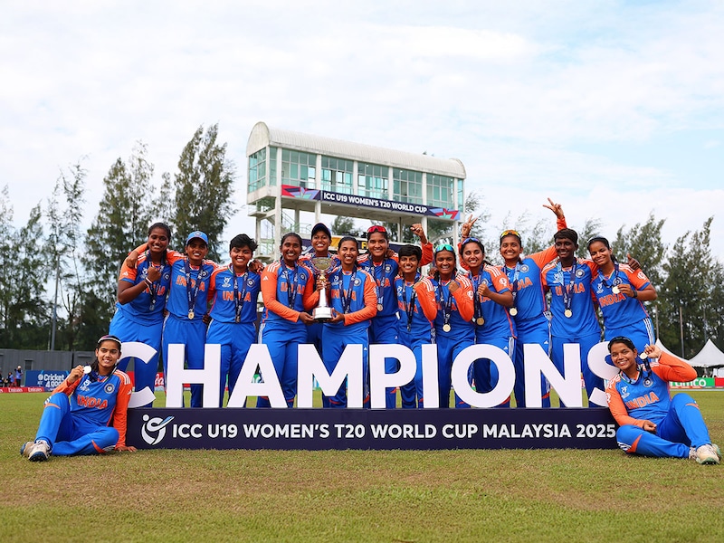 Trisha G and Niki Prasad of India hold the trophy alongside teammates after winning the ICC Women"s U19 T20 World Cup 2025 Final between South Africa and India at Bayuemas Oval on February 02, 2025, in Kuala Lumpur, Malaysia.