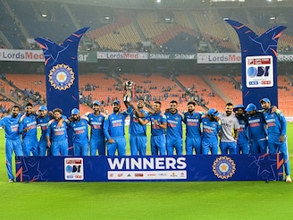 India"s players pose with the trophy after winning the ODI series at the end of the third one-day international cricket match against England at the Narendra Modi Stadium in Ahmedabad on February 12, 2025.