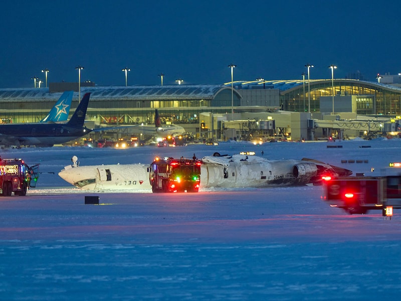 A Delta Air Lines plane sits on its roof after crashing upon landing at Toronto Pearson Airport in Toronto, Ontario, on February 17, 2025. A Delta Air Lines jet with 80 people onboard crash-landed on Monday at the Toronto airport, officials said, flipping upside down and leaving at least 15 people injured but causing no fatalities. The airline said the Endeavor Air flight 4819, with 76 passengers and four crewmembers, was landing at around 3:30 pm in Canada"s biggest metropolis, having flown from Minneapolis in the US state of Minnesota.