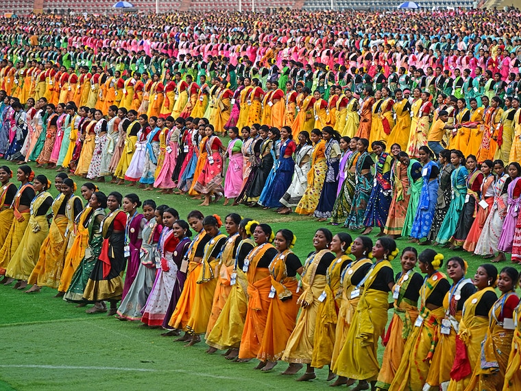 Thousands of dancers perform "jhumur", an Indian folk dance, as they rehearse for the upcoming Jhumur Festival at the Sarusajai Stadium in Guwahati on February 21, 2025. The festival is scheduled for February 24, 2025, with over 7,500 dancers participating in it.