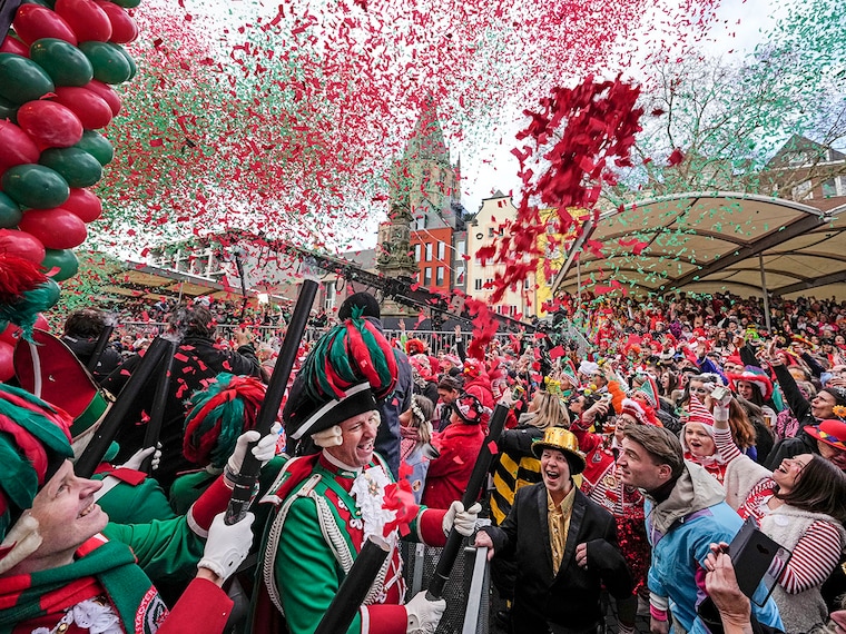 Revellers celebrate the start of the street carnival at the Alter Markt (Old Marketplace) in Cologne, Germany, on Thursday, February 27, 2025.