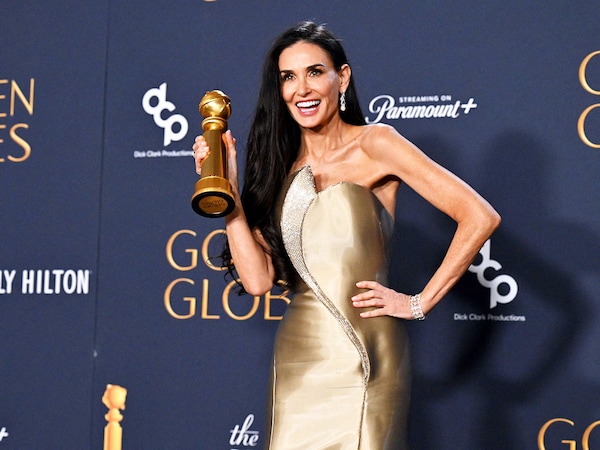 US actress Demi Moore poses with the Best Performance by a Female Actor in a Motion Picture – Musical or Comedy award for "The Substance" in the press room at the Golden Globes. 
Image: Robyn Beck / AFPÂ©