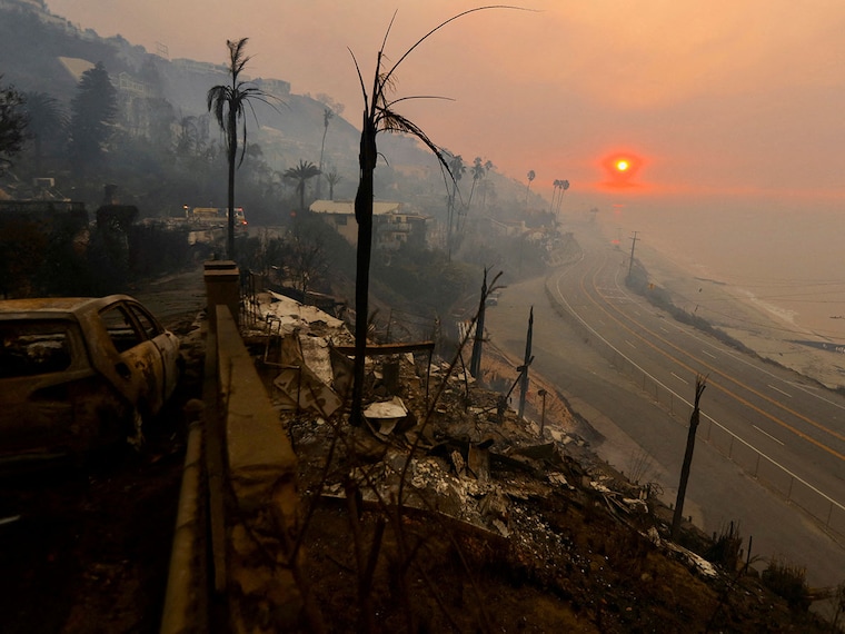 The sun rises over the Pacific Palisades neighbourhood of west Los Angeles on January 9, 2025, in the aftermath of devastating wildfires that forced people to evacuate the area.