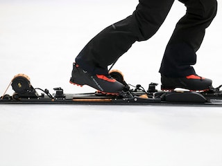 E-SKIMO founder Nicola Colombo demonstrates his company’s electric assisted skis during an E-SKIMO event at Hylo Park Ice Arena. 
Image: Ian Maule / AFPÂ©