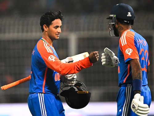 India"s Abhishek Sharma (L) is congratulated by Hardik Pandya for his innings during the first T20 international cricket match between India and England at the Eden Gardens in Kolkata on January 22, 2025.