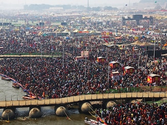 Pilgrims gather to take a holy dip at Sangam, the confluence of the Ganges, Yamuna and mythical Saraswati rivers, on the occasion of "Mauni Amavasya" during the Maha Kumbh Mela festival in Prayagraj on January 29, 2025. A stampede at the world"s largest religious gathering killed at least 15 people, with many more injured, a doctor at the Kumbh Mela festival in northern India told AFP.