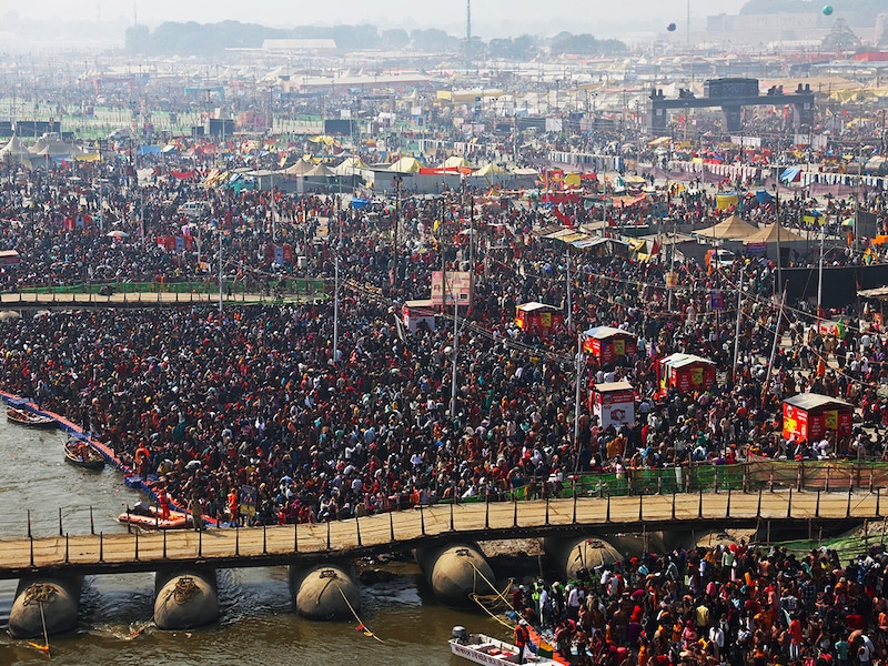 Pilgrims gather to take a holy dip at Sangam, the confluence of the Ganges, Yamuna and mythical Saraswati rivers, on the occasion of "Mauni Amavasya" during the Maha Kumbh Mela festival in Prayagraj on January 29, 2025. A stampede at the world"s largest religious gathering killed at least 15 people, with many more injured, a doctor at the Kumbh Mela festival in northern India told AFP.