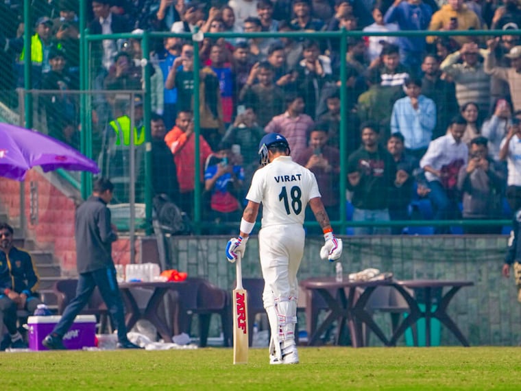 Delhi"s Virat Kohli returns to the pavilion after being dismissed by Railways" Himanshu Sangwan on the second day of a Ranji trophy cricket match between Delhi and Railways at the Arun Jaitley Stadium in New Delhi on Friday, January 31, 2025.