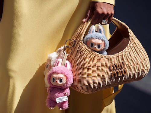 Labubu bag charms are seen on a straw Miu Miu bag at the Cannes Film Festival this year in France. Image: Raimonda Kulikauskiene/Getty Images