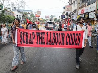 Supporters of trade unions take part in a protest rally during an all-India strike in Kolkata, India, on July 9, 2025. The strike, called Bharat Bandh, is organised by a joint forum of 10 central trade unions, along with associated workers" and farmers" organisations, to protest against what they describe as the central government"s "anti-worker, anti-farmer, and pro-corporate" policies. Media reports indicate that around 250 million workers are participating in the nationwide shutdown.