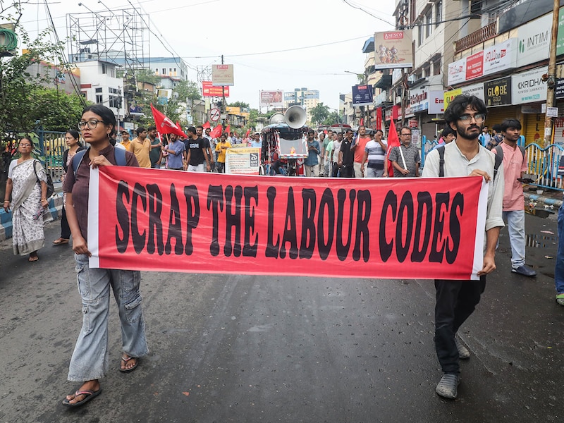 Supporters of trade unions take part in a protest rally during an all-India strike in Kolkata, India, on July 9, 2025. The strike, called Bharat Bandh, is organised by a joint forum of 10 central trade unions, along with associated workers" and farmers" organisations, to protest against what they describe as the central government"s "anti-worker, anti-farmer, and pro-corporate" policies. Media reports indicate that around 250 million workers are participating in the nationwide shutdown.