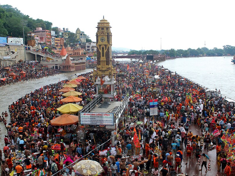 Kanwariyas, devotees of Hindu god Shiva, gather to collect holy water from the river Ganges for the "Kanwar Yatra" pilgrimage during the sacred month of Sawan, at the Har Ki Pauri Ghat in Haridwar on July 16, 2025.