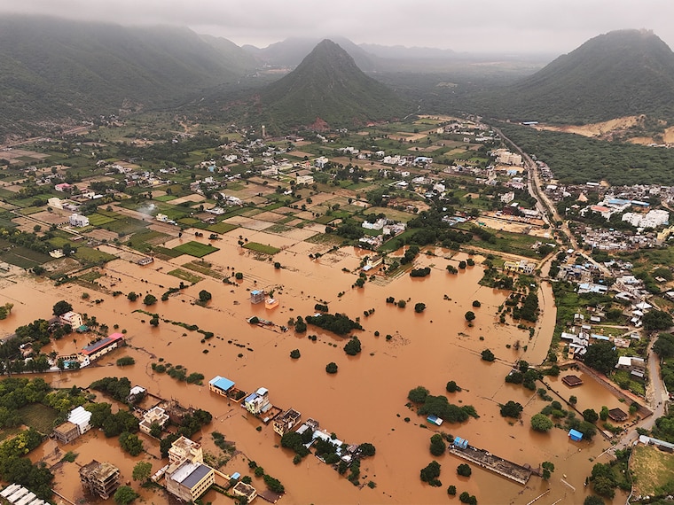 An aerial view shows buildings partially submerged in floodwaters after heavy monsoon rains in Pushkar on July 19, 2025. Heavy rainfall in Rajasthan over the past 24 hours has resulted in flood-like conditions in several cities, including Ajmer, Pushkar, Bundi, Sawai Madhopur, and Pali, officials said on Saturday.