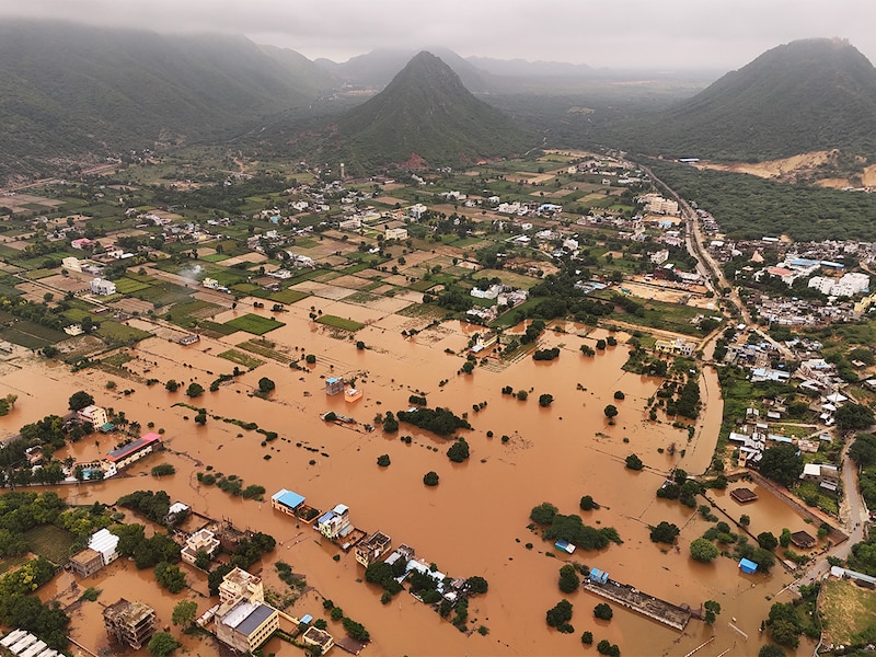 An aerial view shows buildings partially submerged in floodwaters after heavy monsoon rains in Pushkar on July 19, 2025. Heavy rainfall in Rajasthan over the past 24 hours has resulted in flood-like conditions in several cities, including Ajmer, Pushkar, Bundi, Sawai Madhopur, and Pali, officials said on Saturday.